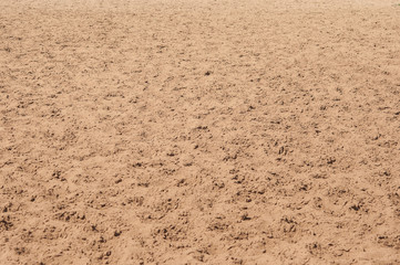 closeup of sand pattern of a beach in the summer