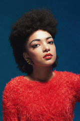 Elegant woman with Afro hair wearing fuzzy tops