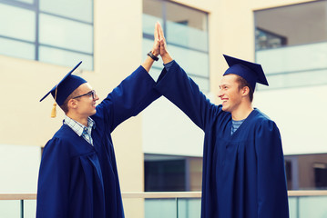 smiling students in mortarboards