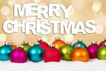 Merry Christmas many colorful balls golden background with snow