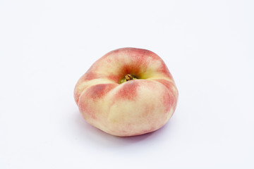 Ripe flat Chinese peaches on the white isolatd background
