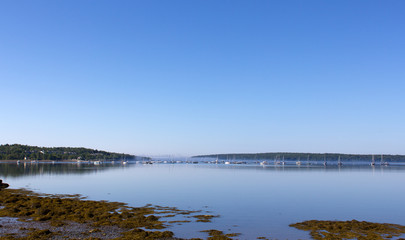 Stockton Springs Maine harbor with coast and boats