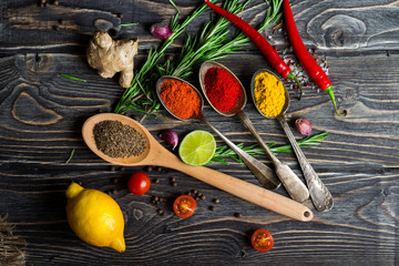 Spices over wooden background