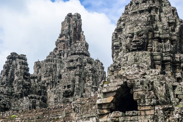 Fototapeta na wymiar Smile of Angkor, stone sculpture of gods head