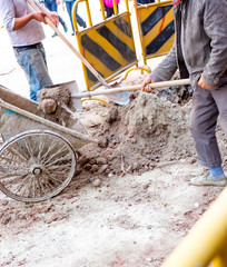 man dig dirt at construction site