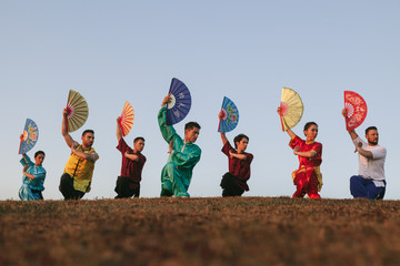 Group of People Practising Martial Arts Outdoors