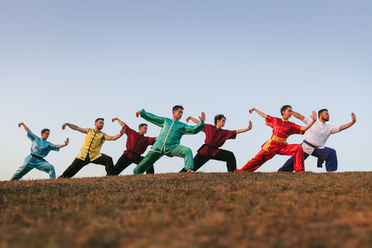 Group of People Practising Martial Arts Outdoors