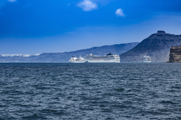 Fototapeta na wymiar Cruise boats moored in Santorini Greece