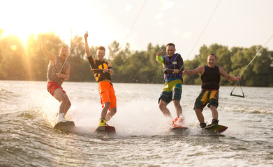 Four wake bord riders having fun