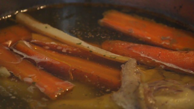 Preparation of chicken soup.Chicken soup on the stove-close up