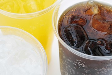 fizzy drinks in plastic beakers