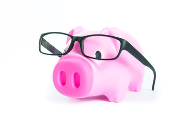 Piggy bank with glasses isolated