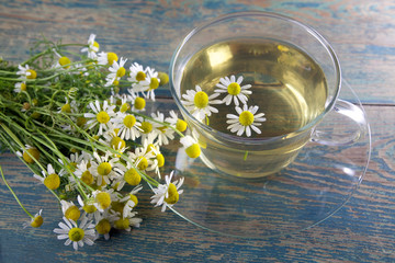 cup of chamomile tea with flowers