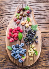 Ripe berries on the old wooden plank.
