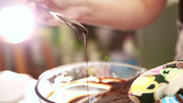 Making Chocolate Brownie Cake. Pouring Melting Chocolate