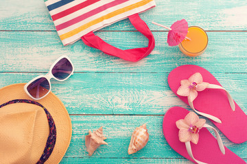Summer vacation. Pink sandals by swimming pool.