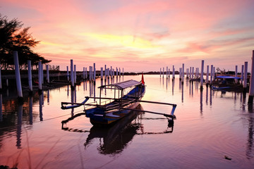 Fototapeta na wymiar Fisherman boat and the sunset