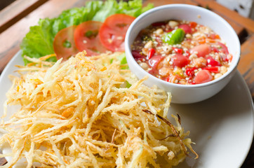 Deep fried papaya salad with spicy sauce
