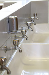 taps at the sink in the bathroom of school