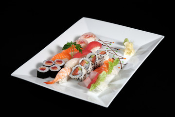 sushi and sashimi with wasabi on plate