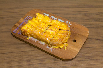 french toast with butter and milk wood back ground