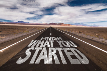 Finish What You Started written on desert road
