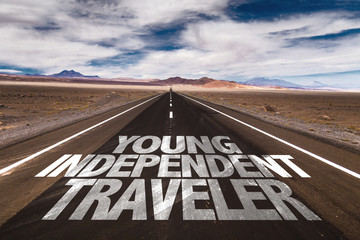 Young Independent Traveler written on desert road