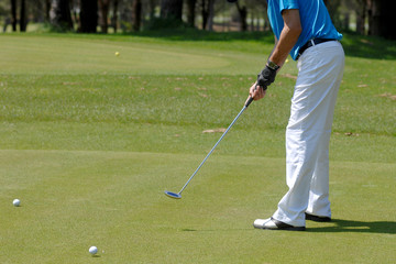 Fototapeta premium Golf ball behind driver at driving range
