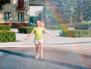 Girl is running through fountains