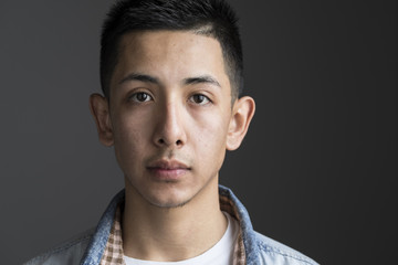 Studio portrait of a young man, close up