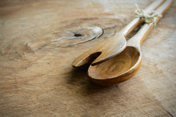 wooden spoon and fork on old wooden table