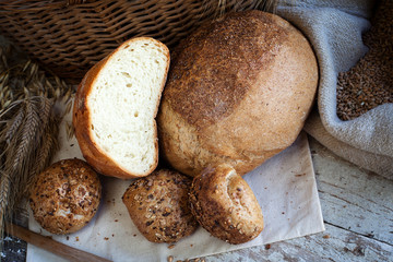 fresh bread and wheat on the wooden table