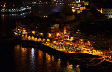 Fototapeta na wymiar Night scene of Porto with Douro river and old town on hill, Portugal