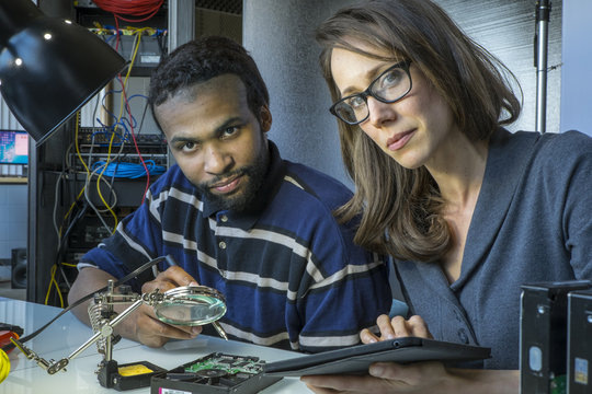 Portrait of male and female information technology workers