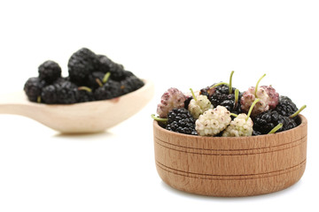 isolate, mulberry in a wooden bowl