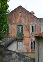 Fototapeta na wymiar Facade of an old abandoned building