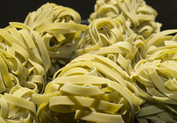 Food background. Tagliatelle with spinach.