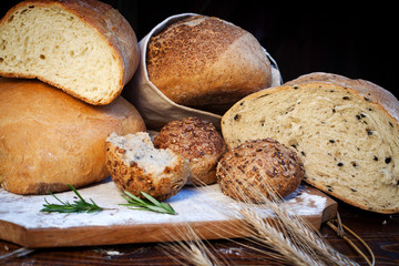 fresh bread and wheat on the wooden table