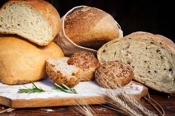 fresh bread and wheat on the wooden table