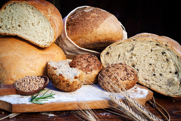 fresh bread and wheat on the wooden table