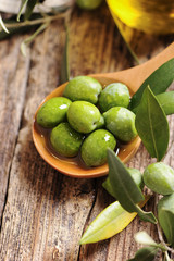 Olive oil with fresh olives
