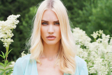 Beautiful Blond Woman with flowers