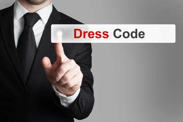 businessman pushing button dress code
