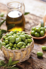 Olive oil with fresh olives

