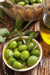 Olive oil with fresh olives
