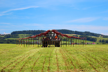 Farmer spraying field