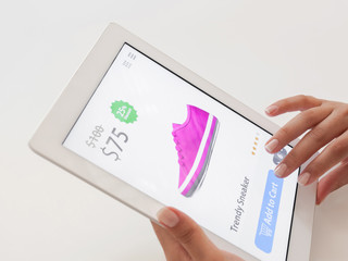 woman doing internet shopping on tablet computer.