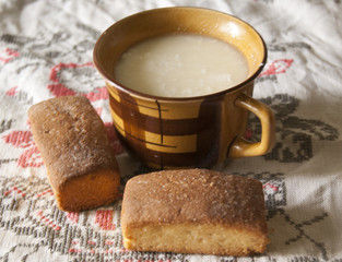 cup of sour milk amd fresh biscuits