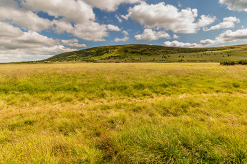 Fototapeta na wymiar Landscape with mountain and land, nice clouds in Krkonose in Czech republic 