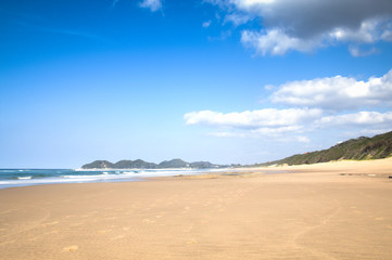Fototapeta na wymiar Empty beach in the town of Ponta Do Ouro in Mozambique 